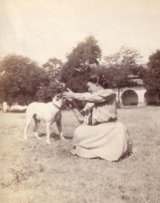 Madonna sitting outdoors with Pete the dog
