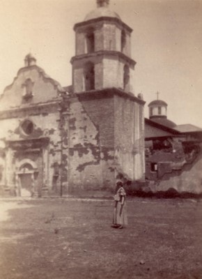 Madonna standing at San Luis Rey Mission during the California journey