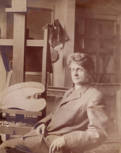 Carl Ahrens working in his studio around 1910