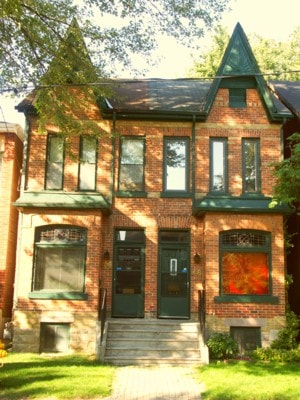 Brick Toronto townhouse with a steep gabled roof